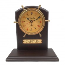Brass marine clock in a wooden case