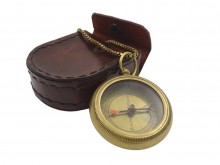 Brass compass with a chain in a leather case