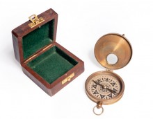 Brass compass in wooden box