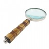 An exclusive brass magnifier with a bone handle
