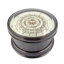 Brass compass with a floating shield