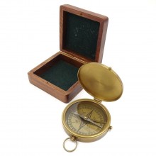 Brass tourist compass in a wooden box