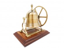 Brass rotating bell on a wooden base