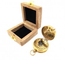 Brass compass with sundial in a wooden box