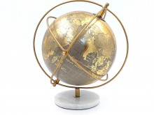 Decorative globe with rings on a stone base