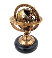 Brass astrolabe on a black stone base