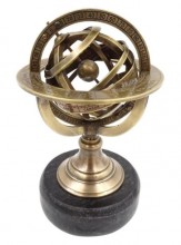 Brass astrolabe on a black stone base