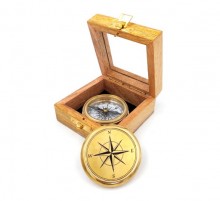 Brass compass in a wooden box