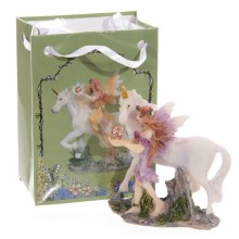 Figurine forest fairy with a unicorn in a bag