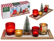 A wooden stand with candlesticks with a Christmas ...